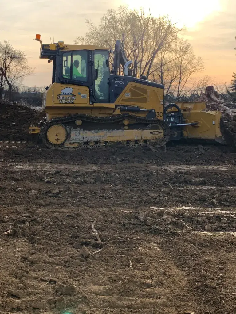 Excavator pushing dirt